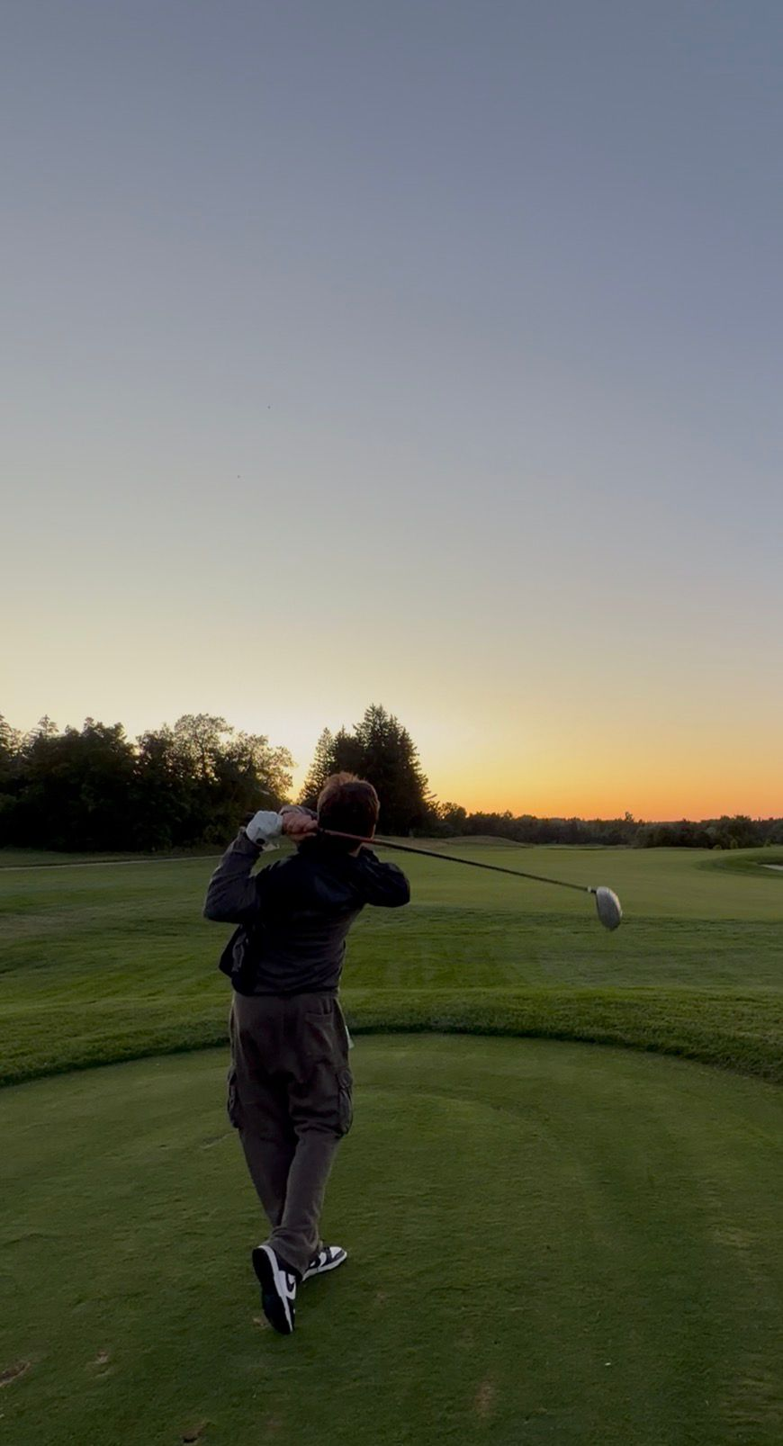 Sahain on a golf course at sunset