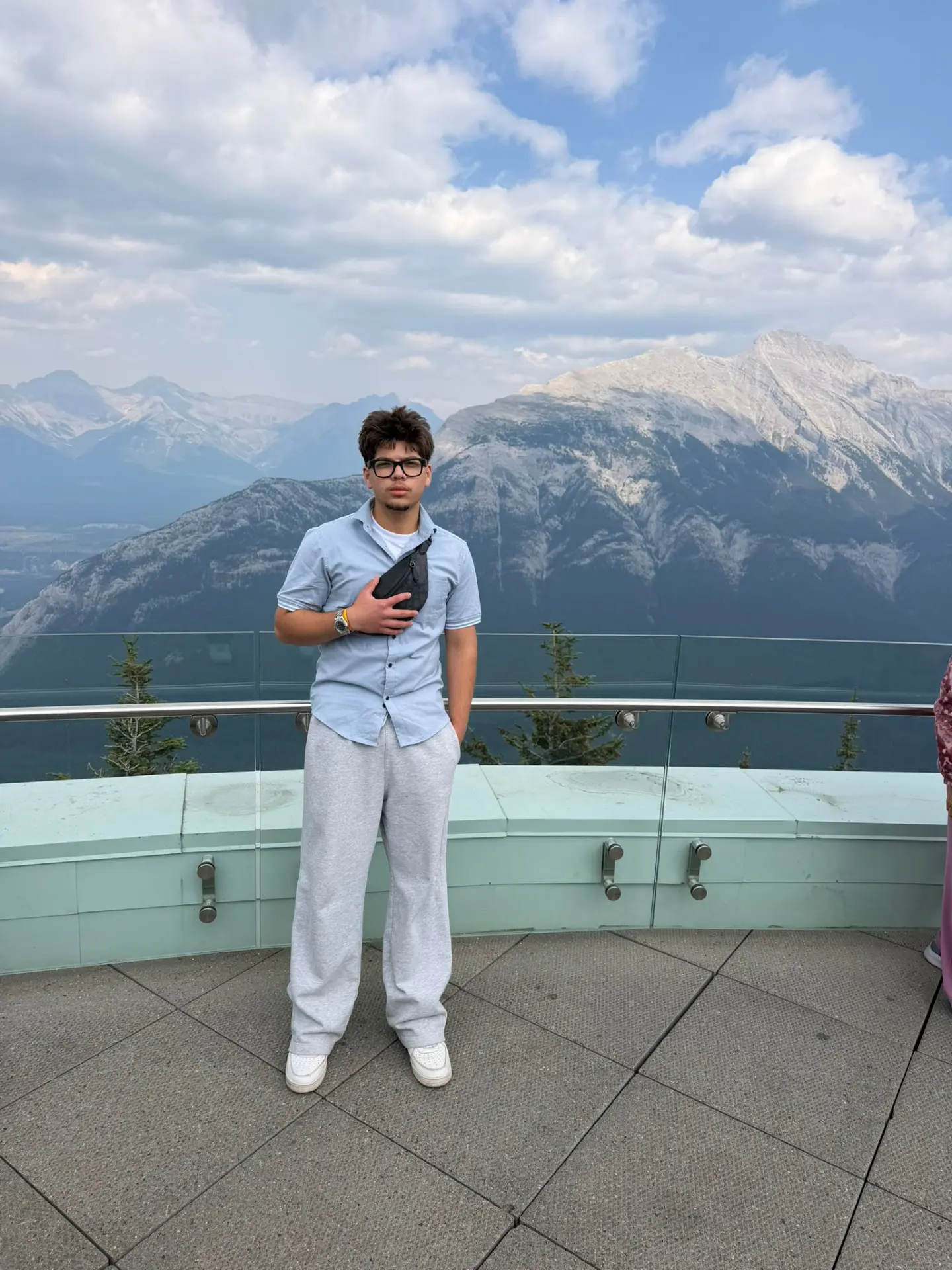 Sahain standing in front of mountains